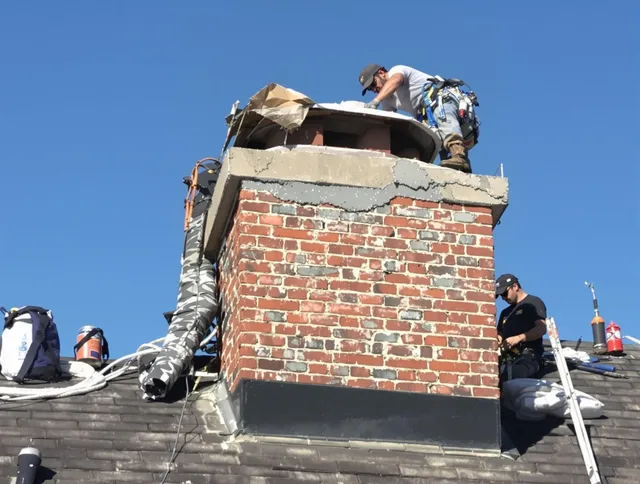 Hacienda Heights Chimney Sweep installing a custom chimney crown in Hacienda Heights, CA