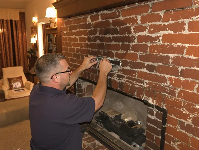 Hacienda Heights Chimney Sweep expert fixing a fireplace in Hacienda Heights, CA